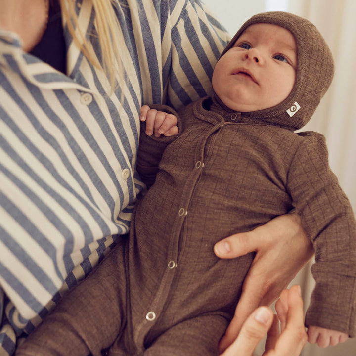 Strampler mit Füßen aus Merinowolle